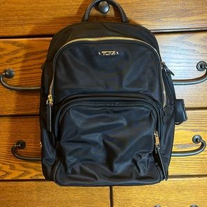 Tumi black commuter backpack.
